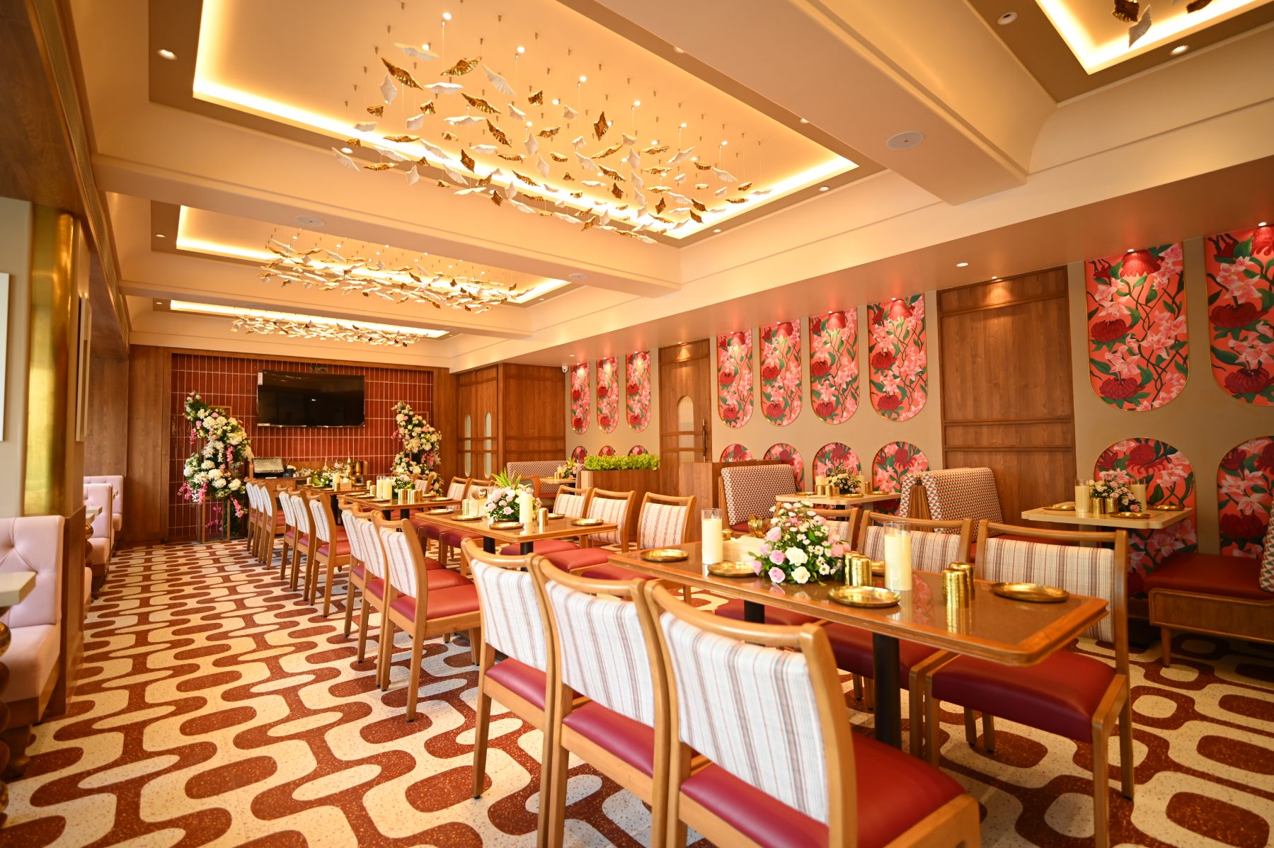 Interiors of Anantha Veg World, Mira Road East, with hand-painted floral panels